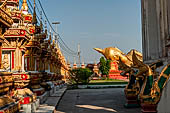 Vientiane, Laos - Pha That Luang, large gilded reclining Buddha within the temple area. 